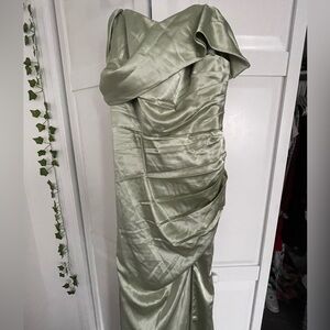 Sage green dress with long dress tail 
Off the shoulders